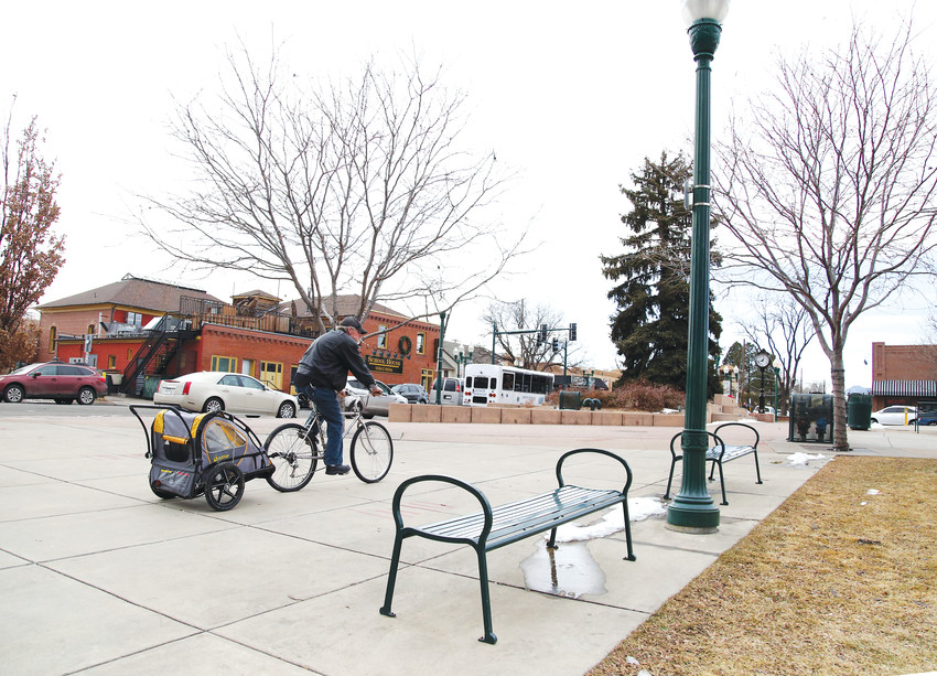 A homeless man bicycles through Olde Town Arvada Jan. 30. Volunteers at the nearby Rising Church and the Arvada Library conducted Point in Time surveys of the area's homeless population for the annual survey.