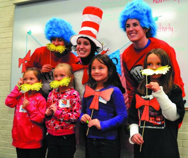 Mariah Leyva , Rachel Starcevic, Rhiannon Willard and Jadelah Jordan, first grade students, posed for a quick photo with the Cat in the Hat, Thing One and Thing Two at Allendale’s Seussival.