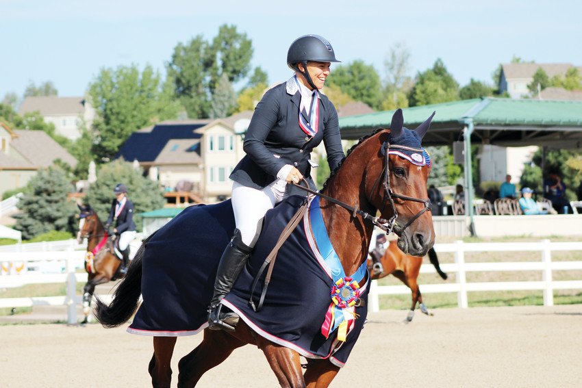 Heather Morris, riding Charlie Tango, takes her victory lap after being crowned the first-place winner of the intermediate division at the American Eventing Championship at the Colorado Horse Park Sept. 2.