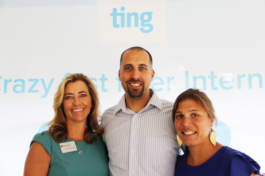 At middle and right, Isaac and Erin Herman, whose home in the Willow Creek neighborhood was the first residence in Centennial to receive fiber-optic internet from Ting. They stood with Mayor Stephanie Piko on Sept. 6 at their home at an event to celebrate the “light-up” of their internet service. Behind them reads Ting’s “crazy fast fiber internet” slogan.