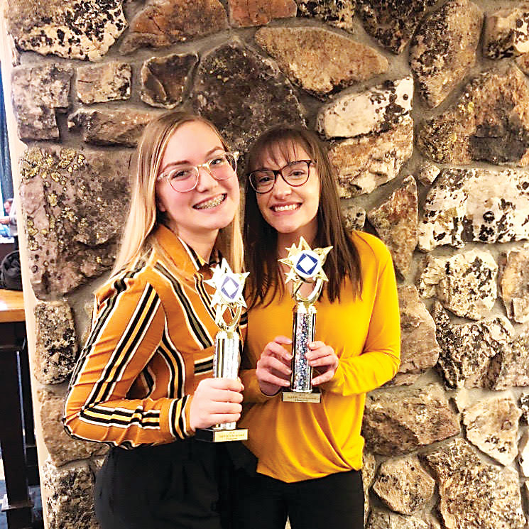 Faith Bochert, 16, left, and Talia Rotella, 17, are juniors at Mountain Range High School’s High School of Business and represent the school at DECA business competitions.