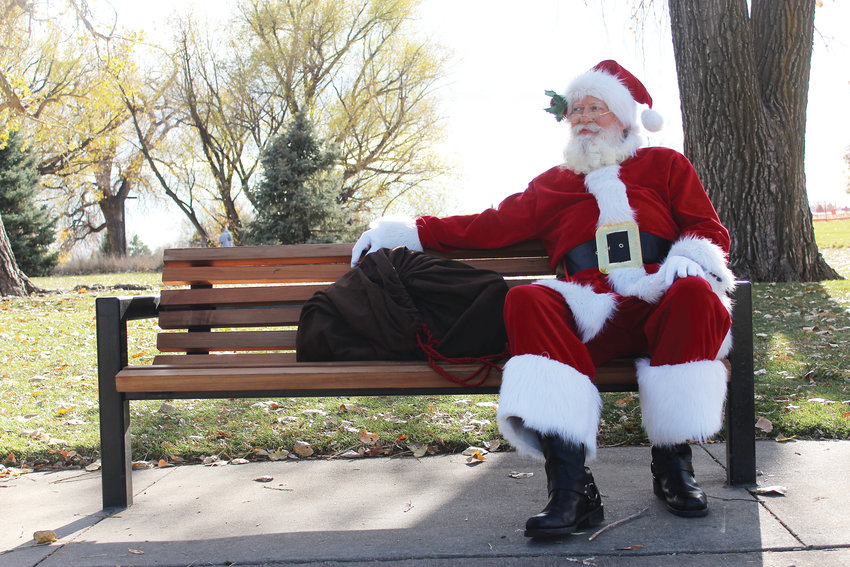 Mike Cawthra, 64, sits at a bench at Addenbrooke Park in Lakewood dressed as Santa after a Nov. 10 event at the local Goddard School. Cawthra said the best part about the job is all the joy and love your receive and give on a daily basis.