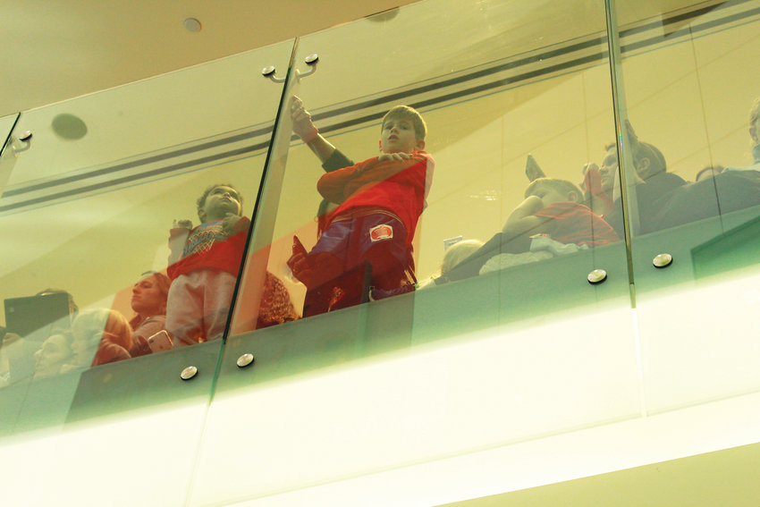 Children watch down from the balconies as Obama enters the lobby of the Children's Hospital Colorado.