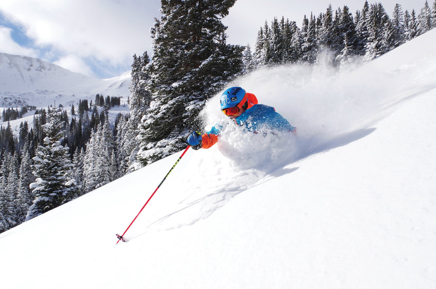 A skier skis through the powder at Loveland Ski Resort.
