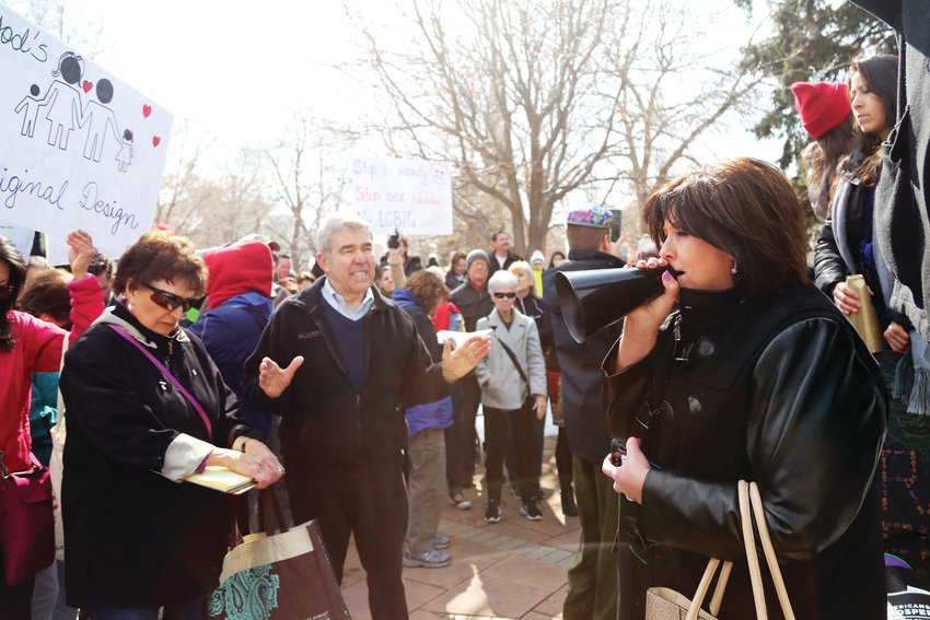 Debbie Chaves, of Colorado Family Action, leads the crowd in prayer Feb. 27 at a gathering in opposition to the proposed sex education bill.