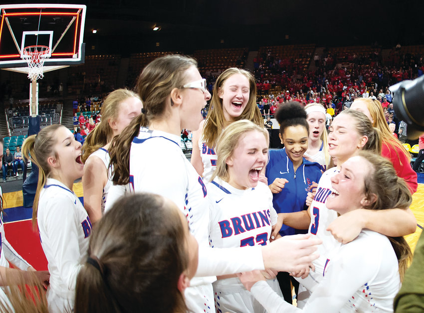 The Cherry Creek girls basketball team celebrates winning the 5A State final over Grandview 51-49 Saturday at the Denver Coliseum.