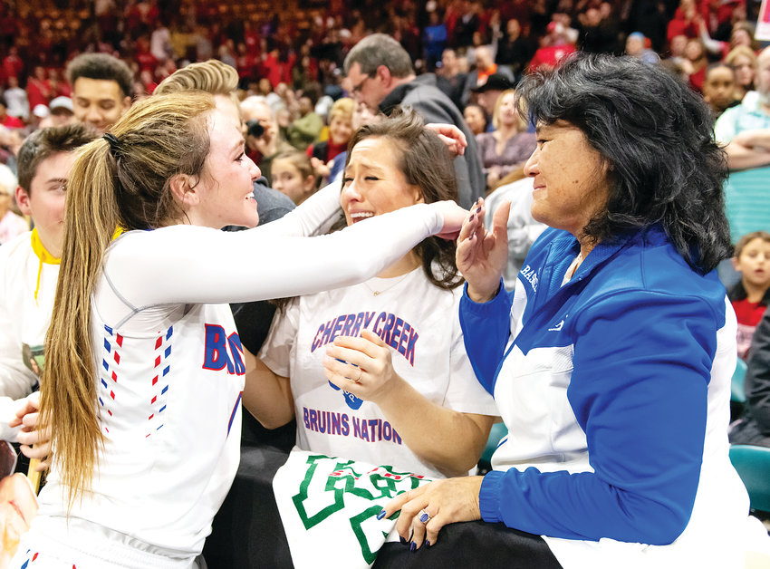 Cherry Creek's Jana Van Gytenbeek gets a congratulatory hug from her sister Kyli Soto as her mother, Carol Van Gytenbeek, looks on. Van Gytenbeek led a late-game rally and made the game-winning basket with seconds left in the game.
