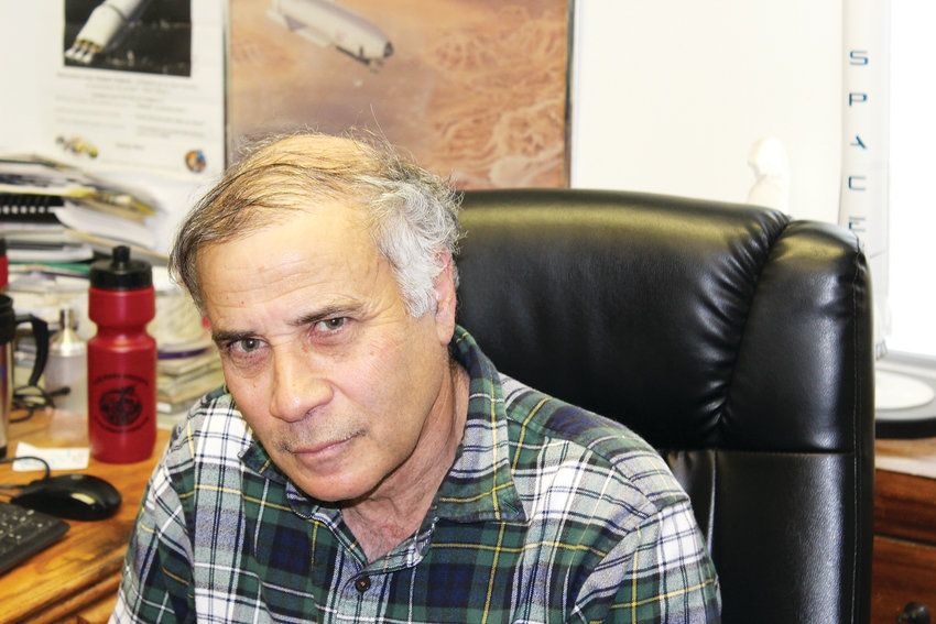 Robert Zubrin, co-founder of The Mars Society, sits in his Lakewood office.