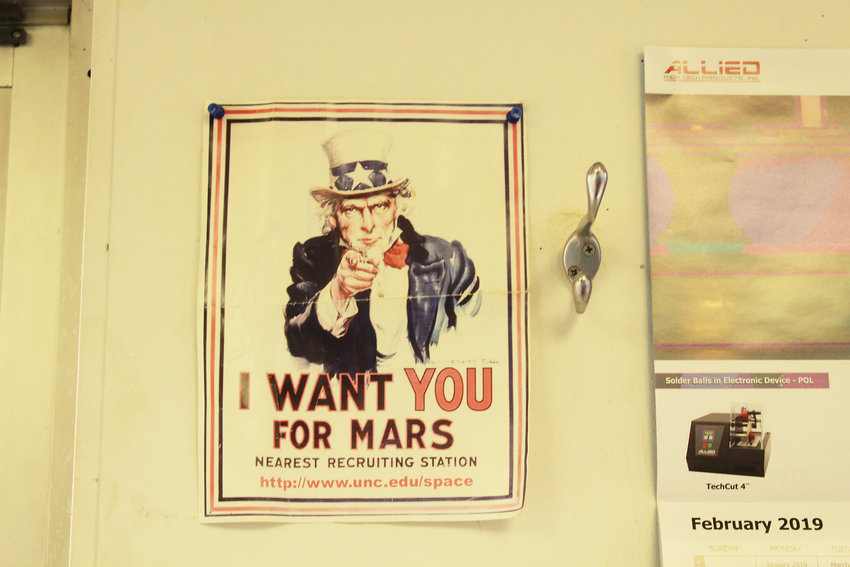 A poster that hangs inside The Mars Society’s main office in Lakewood.