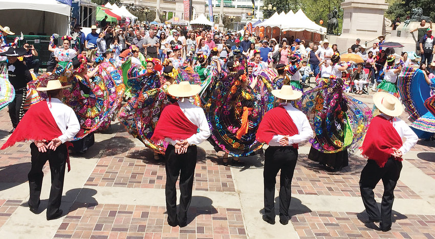 Performers attract a crowd at Denver’s Cinco de Mayo Festival. This year’s event takes place May 4 and 5 at Civic Center Park in downtown Denver.