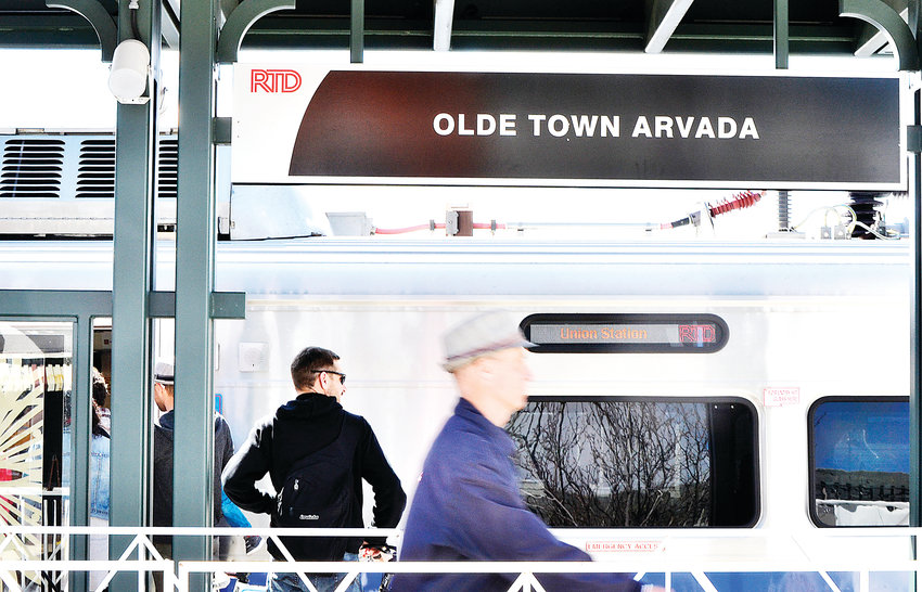 People board the G-Line during the grand opening celebration Saturday, April 27, in Olde Town Arvada.