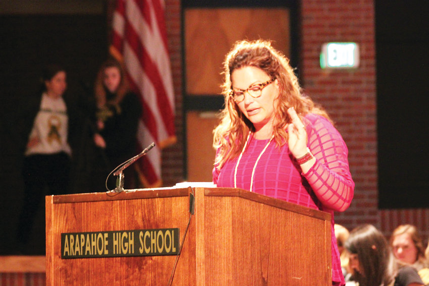 Jessica Roe, parent of an Arapahoe High School student, speaks on behalf of the Arapahoe High School Community Coalition at a special meeting on May 2. Roe's group alleges Arapahoe's leadership has mishandled the response to problems at the school.