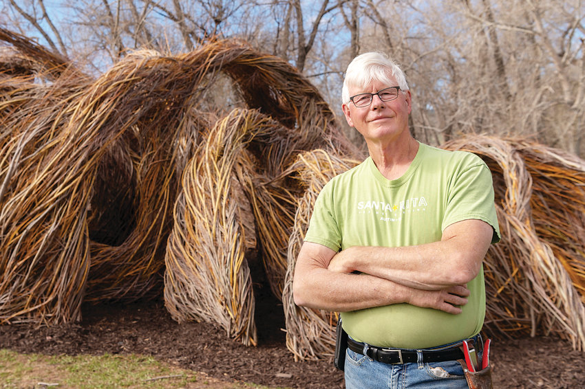 Artist Patrick Dougherty with the newly finished “One Fell Swoop” at Denver Botanic Gardens at Chatfield Farms.