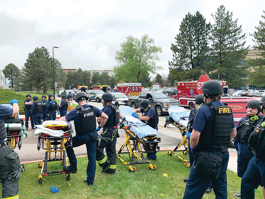 South Metro Fire Rescue personnel line up, ready to pull injured victims from STEM School Highlands Ranch on May 7. Personnel from numerous local agencies responded to the scene of the shooting.