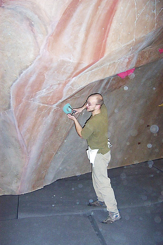 Scott Rennack, marketing manager for The Spot Bouldering Gym who has been climbing for about 25 years, sets a route when the gym’s Boulder location opened in 2002. The Spot Denver opened on April 18.