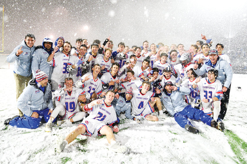 Cherry Creek's boys lacrosse team gets in a last chance to play in the snow as they celebrate their 12-7 victory over Kent Denver in the 5A State Final on May 20 at All City Field.