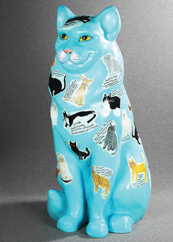 Cat sculpture, painted by Mary Clark of the Littleton Fine Arts Guild. A collection of Painted Cats will be exhibited at the Depot Art Center June 3 to 23.