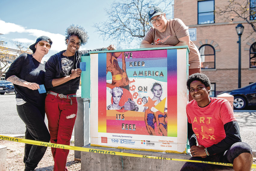 From left, Danie Vigil, Adrienne Norris, Allison Torvik and Vensha McGee pose for a picture after installing a vinyl sticker collage designed by a student from East High School on an electrical box on the corner of East Colfax Avenue and North Lafayette Street on May 11. A group of adult volunteers helped students from the East High School National Arts Honor Society install art in recognition of the 50th anniversary of the Stonewall riots in New York CIty, which launched the modern-era fight for LGBTQ rights.
