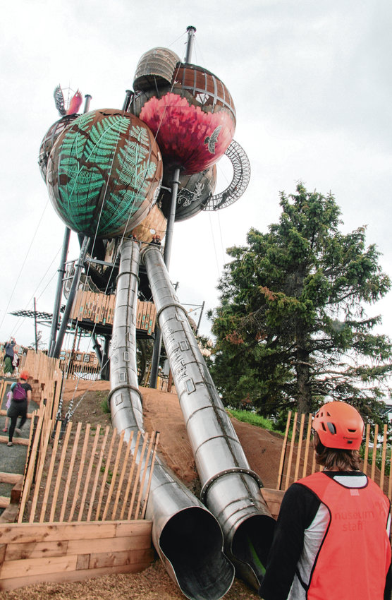 A Children’s Museum employee stands at this station at the base of the two 70-foot tube slides — the fastest way to end an excursion up into the Adventure Forest.