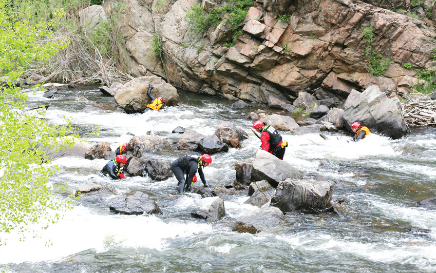 Area firefighters perform a mock search in Clear Creek Canyon near Tunnel 1 on U.S. 6, which is just west of Golden, during a training exercise on May 31. Fifteen firefighters earned their swift water rescue technician certification that day. Participating fire departments were West Metro Fire Rescue, South Metro Fire Rescue, Arvada Fire Department and Westminster Fire Department.
