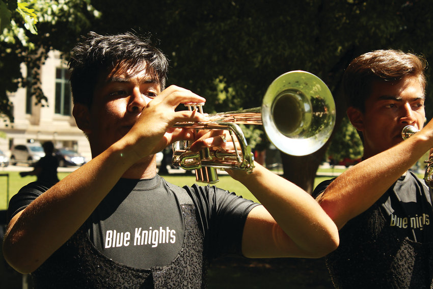 Jesus Alaya, left, and Greg Valean warm up for the Blue Knights performance on June 20.