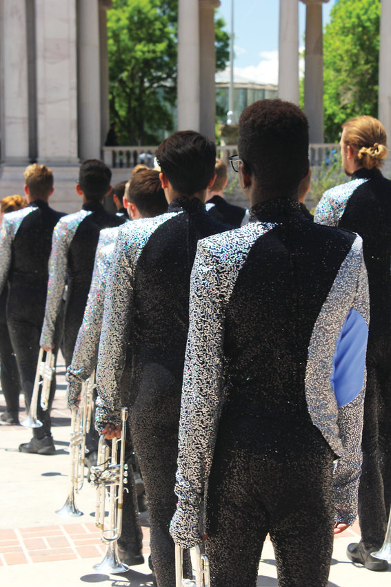 Horn players with the Blue Knights file into the Greek Amphitheatre before a performance at Civic Center in Denver.