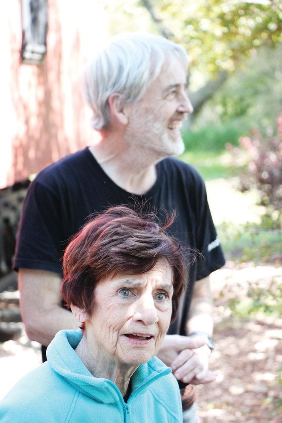 Lynn Salvatore, foreground, and Jerry Schaak, both of whom live with dementia, stand outside Littleton’s Depot Art Center on June 19 as part of a visit through Out &amp; About Colorado.