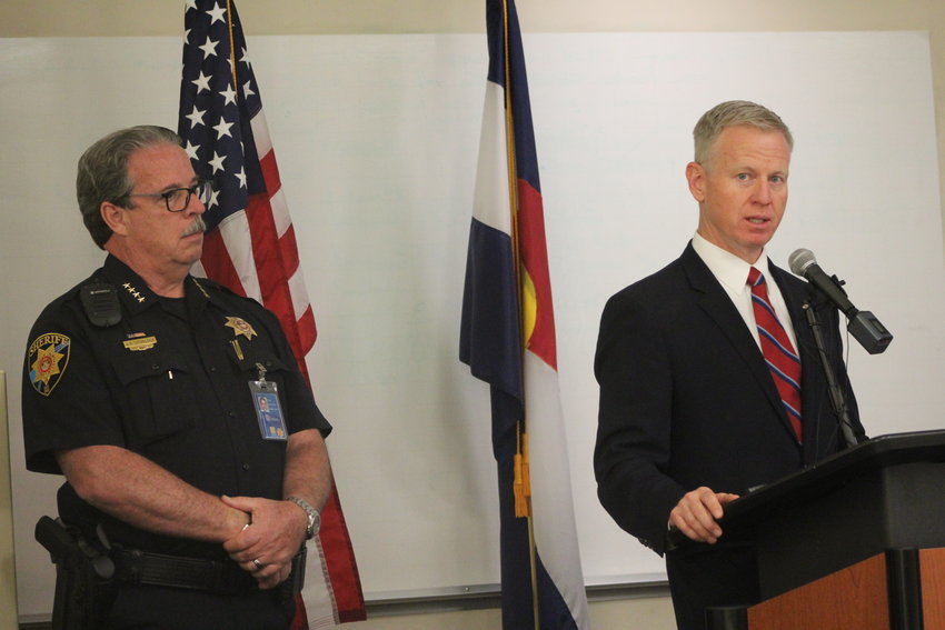 Eighteenth Judicial District Attorney George Brauchler addresses the media during a July 17 press conference at the Douglas County Sheriff's Office substation in Highlands Ranch, accompanied by Sheriff Tony Spurlock. "When someone is involved with someone on a bike, whatever fear sets in, you cannot make it better by fleeing," Brauchler said. "You must stay and own up to the conduct and be there. That is humanity. That is who we are as Coloradans."