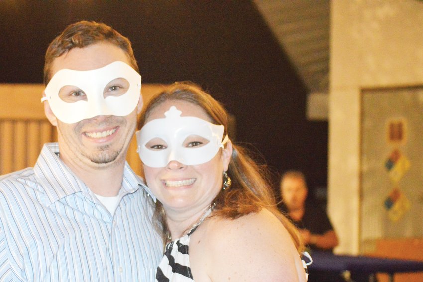 Masqueraded Andrew and Mary-Frances Bigoney, of Erie, pose in the bar at Northglenn’s Magic Festival Aug. 17.