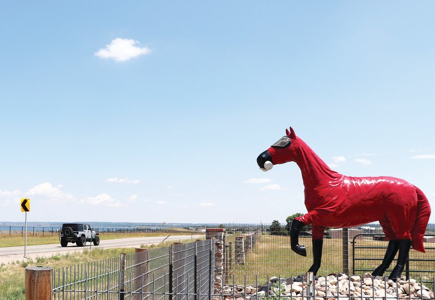 The Cold War Horse sculpture at the former Rocky Flats site off of Highway 72. The statue wears a hazmat suit and respirator as a reference to the contamination found in the soil of Rocky Flats.