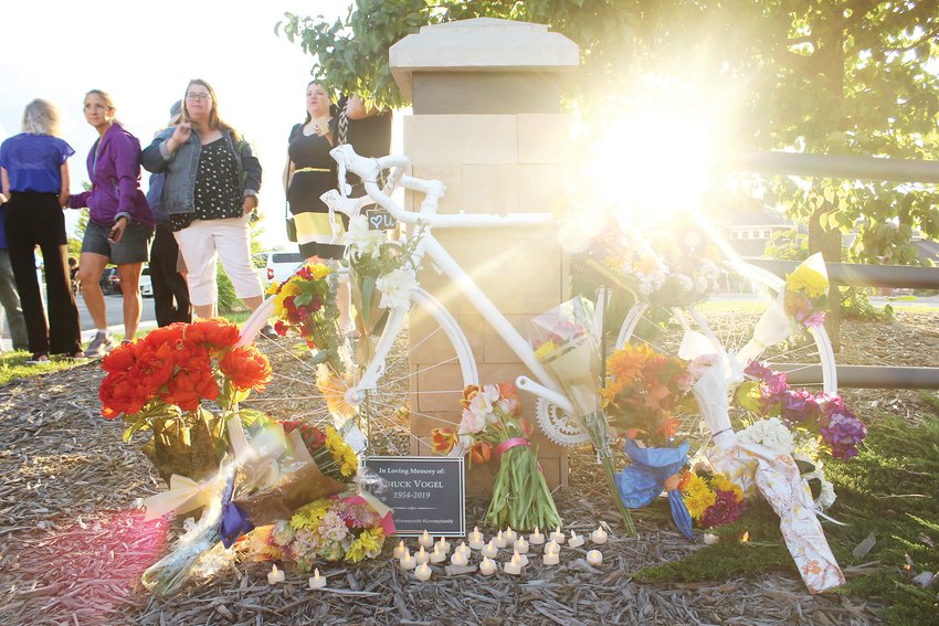 A memorial event was held on Aug. 9 for Edward "Chuck" Vogel in Parker. Mourners placed flowers and electric votive candles around the bike, which was placed near the intersection where Vogel died.