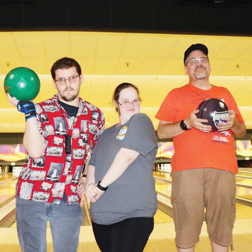 Rick Lorie, left, with friends Elaine and Tommy. The group often joins South Suburban Adaptive Therapeutic Recreation for Saturday morning bowling at AMF Belleview Lanes, 4900 S. Federal Blvd.