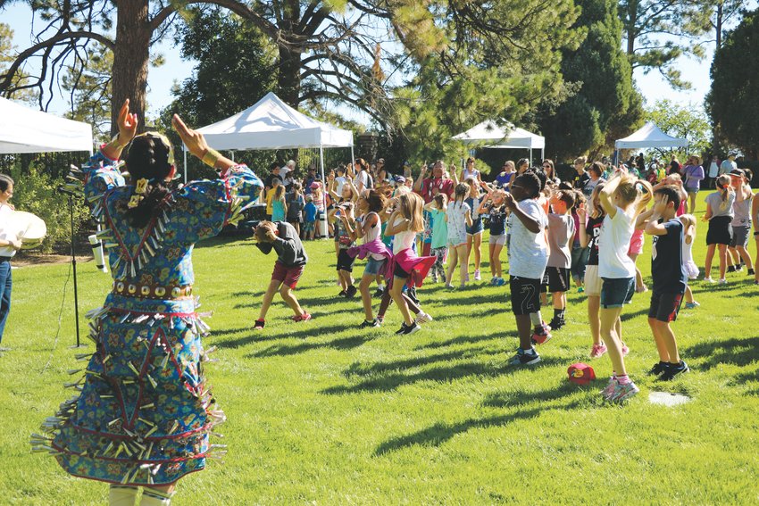 Raelene Whiteshield leads students in a traditional “rabbit dance” during Highlands Ranch Pioneer Days.
