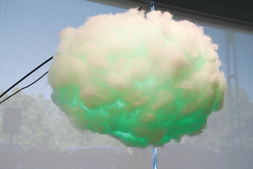 A “cloud” that can read people’s mood and turn certain colors that correspond to it — green is for surprised — sits in a part of the Colorado Open Lab Sept. 12.