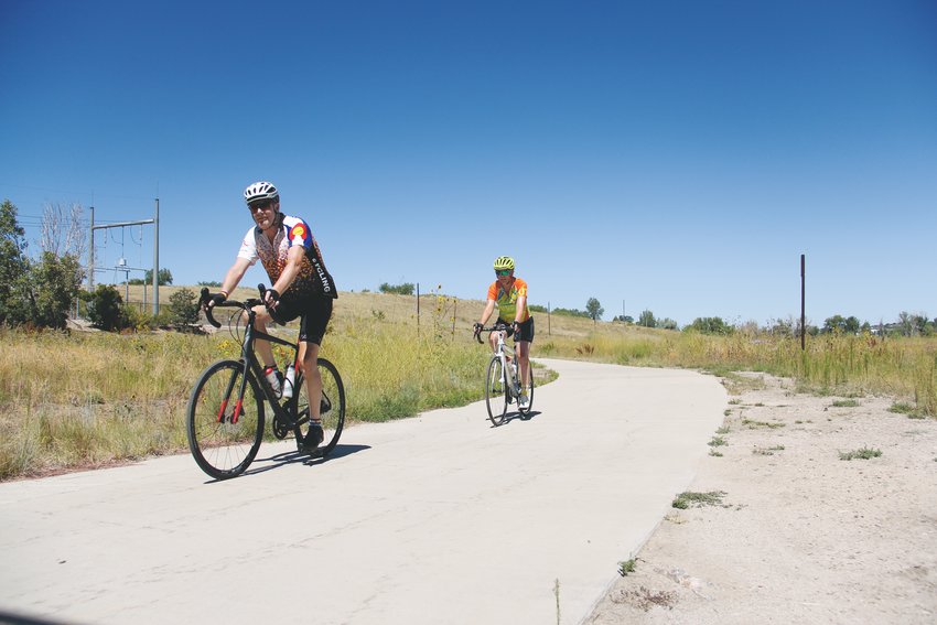 Cyclists ride recently on the Cherry Creek Trail near Centennial.