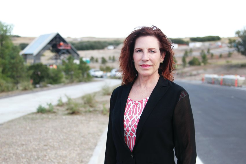 Castle Pines Mayor Tera Radloff stands near what will be the entrance to The Canyons, a developing neighborhood in the city.