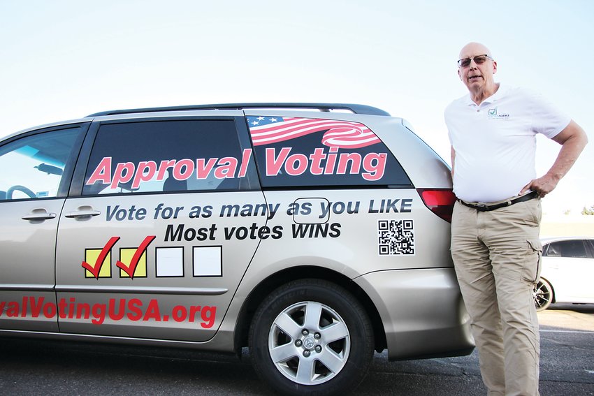Frank Atwood, the chairman of the Approval Voting Party, stands beside his minivan, a sort of rolling billboard. The party achieved minor party status in Colorado in October, meaning it will automatically appear on presidential ballots in years to come. The party seeks to institute what it calls a more equitable voting method.