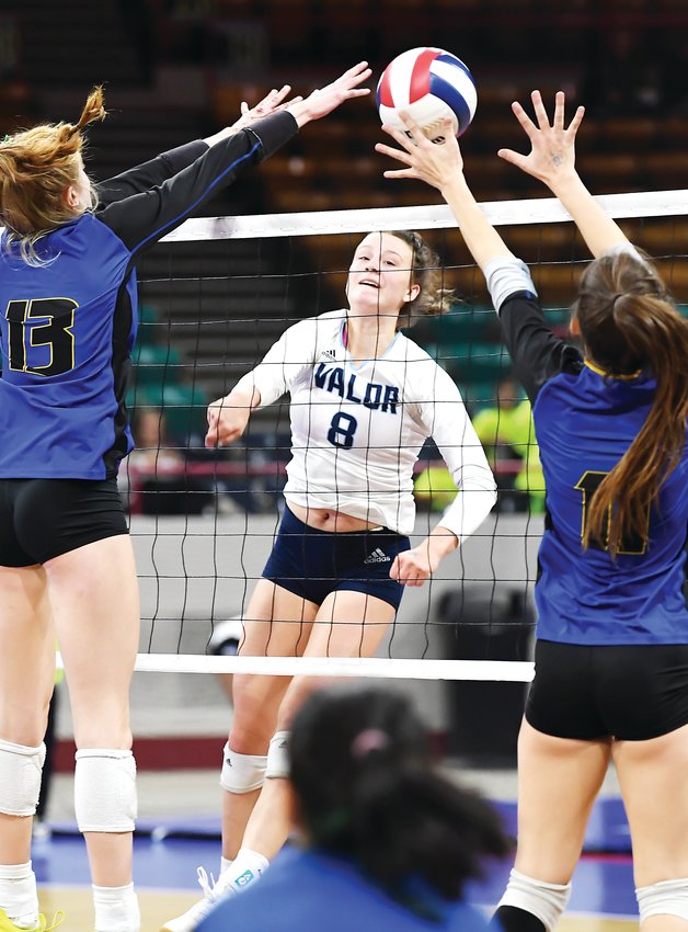 Valor Christian's Anna Davis's kill shot finds the gap between two Rampart defenders. Valor defeated several early round contenders but fell to Chaparral 3-1 in the state final Saturday at the Denver Coliseum.