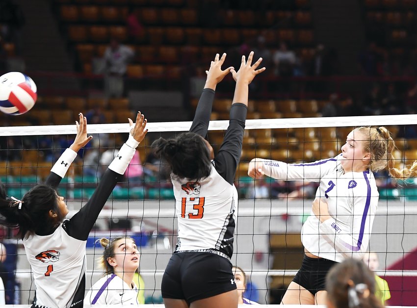 Lutheran's Payton Brgoch (2) lines up her K attempt just past the reach of Sterling defenders Emerie Rios (1) and Kaylee Johnson (13). The Lions defeated several early round contenders but fell to Sterling in the state final Saturday at the Denver Coliseum.