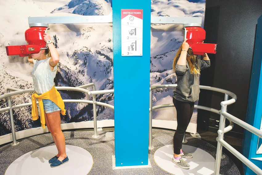 Children use one of the interactive features at the Denver Museum of Nature &amp; Science’s “Extreme Sports: Beyond Human Limits” exhibit. It gives visitors a chance to learn about extreme sports and to explore the psychology, physicality and physiology of extreme sport athletes.