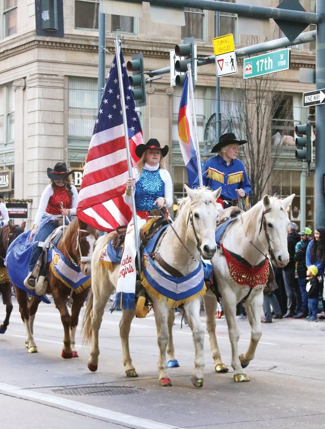 The Colorado Cowgirl's Performance Team, based in northeastern Colorado, make their way along the parade route during the Stock Show Kick-off Parade in downtown Denver on Jan. 9.