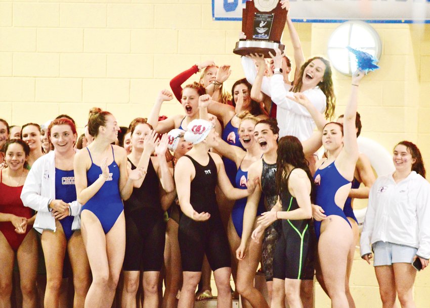 Cherry Creek swimmers celebrate after winning the second-place trophy in the Class 5A state swimming meet held Feb. 13-14 at the VMAC.