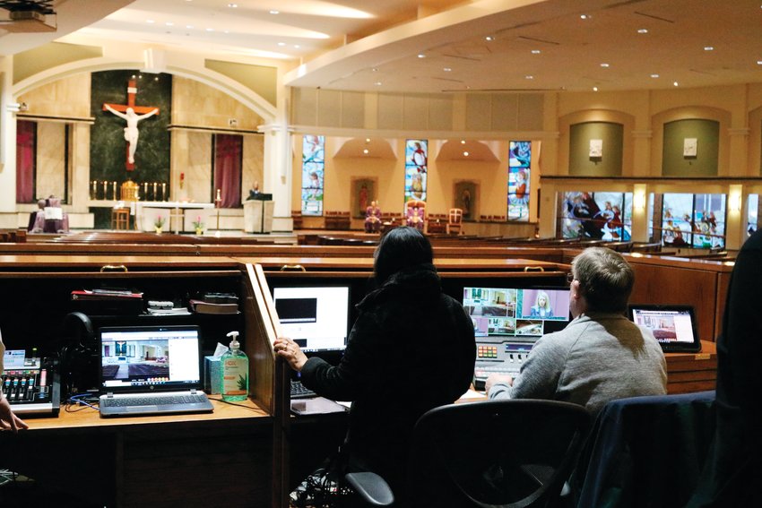 The audiovisual team worked to train other members of the church staff March 20 so that they can alternate who produces the daily mass in the future.