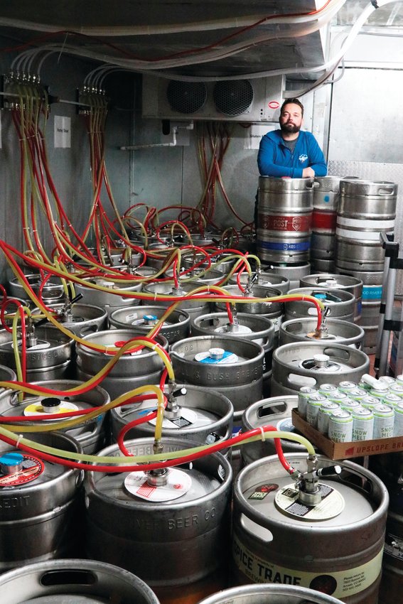 Dave Gardner stands by the more than 80 kegs he has in his taphouse, Max Taps Co, that he can no longer sell. The governor temporarily shut down taphouses and bars in the state to prevent the spread of COVID-19.