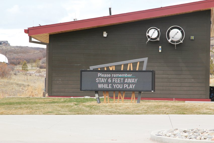 Signage at Philip S. Miller Park in Castle Rock reminded users that they must socially distance while there. The town has closed indoor recreation facilities while leaving other outdoor facilities open.