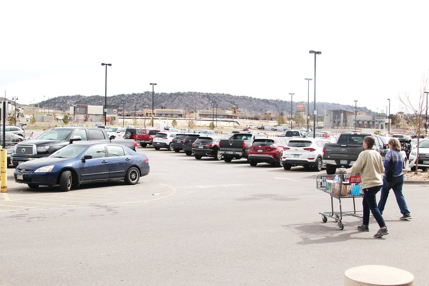 While some stores have closed entirely during the pandemic and their parking lots sit empty during the governor’s stay-at-home order, others businesses remain bustling hotspots, like grocery stores and home improvement stores. Here, shoppers leave the King Soopers near the Promenade at Castle Rock on March 30.