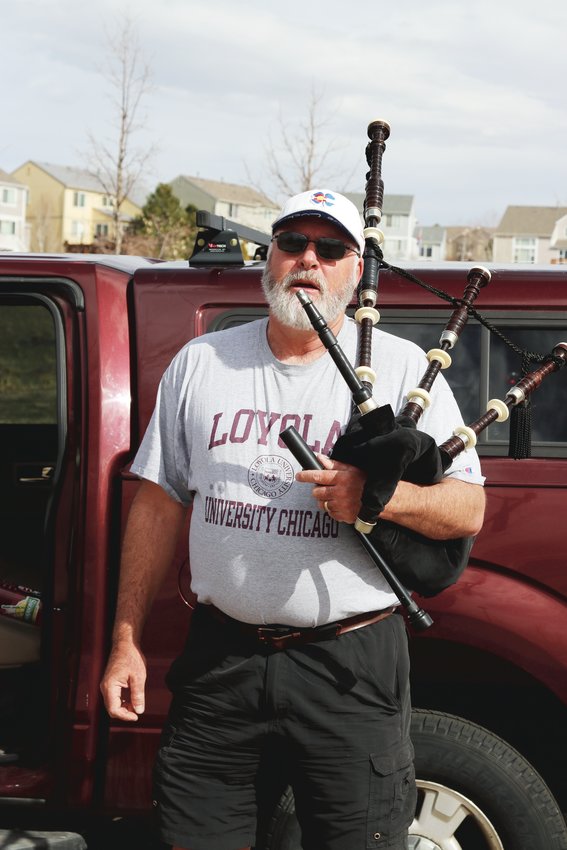 Andrew Michaud, 53, has been playing his bagpipe as he walks the trails in Highlands Ranch. Michaud, who lives in Highlands Ranch, is the band director for Chatfield Senior High School.