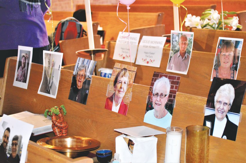 The pews at Advent Lutheran Church would normally be full of people for Easter Sunday services. This year the pews were largely empty due to COVID-19 quarantines, but members placed photos of themselves to greet the pastor.