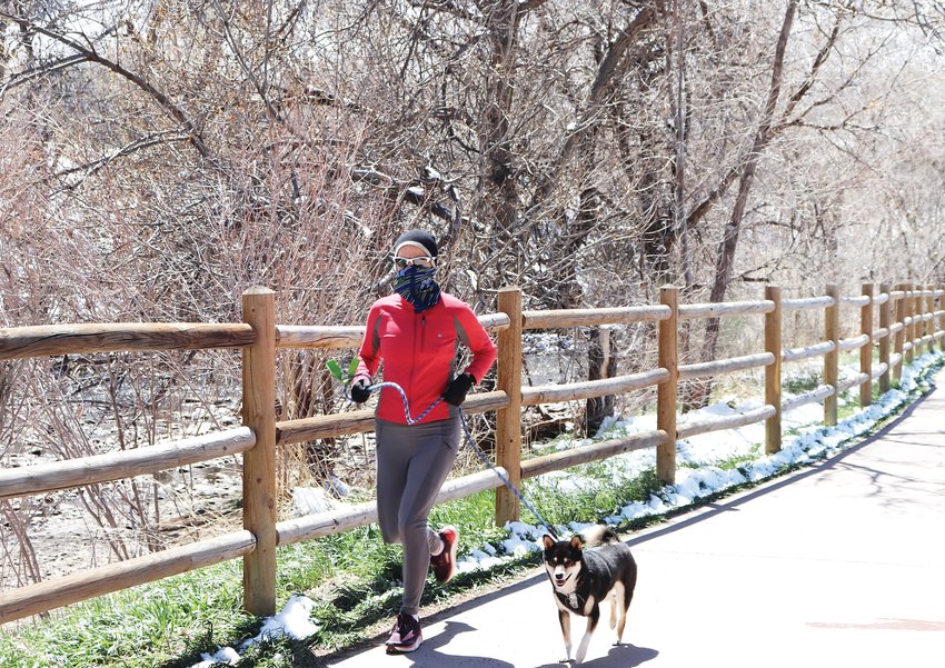Barb Hurtt, who lives in unincorporated Jefferson County, runs along Golden’s Clear Creek Trail. Hurtt has been a runner for about 25 years and has run about half a dozen previous marathons, with plans to run the Boston Marathon this year, postponed until Sept. 14.