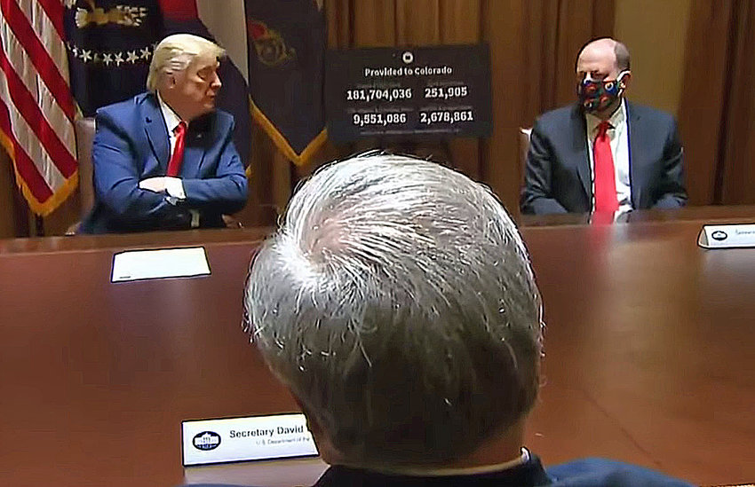 President Donald Trump and Colorado Gov. Jared Polis discuss the COVID-19 situation at the White House on May 13, 2020. In the foreground, back to camera, is U.S. Interior Secretary David Bernhardt, a Coloradan. Also at the meeting, off camera, was U.S. Sen. Cory Gardner, R-Colorado.